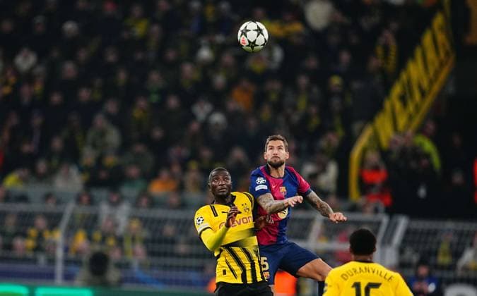 December 11 2024: Inigo Martinez of FC Barcelona, Barca and Serhou Guirassy of Borussia Dortmund battle for the ball during a Champions League Round 6 game, BvB Dortmund v FC Barcelona, at Signal Luna Park, Dortmund, Germany. CSM Dortmund Germany - ZUMAc04_ 20241211_zma_c04_048 Copyright: xUlrikxPedersenx