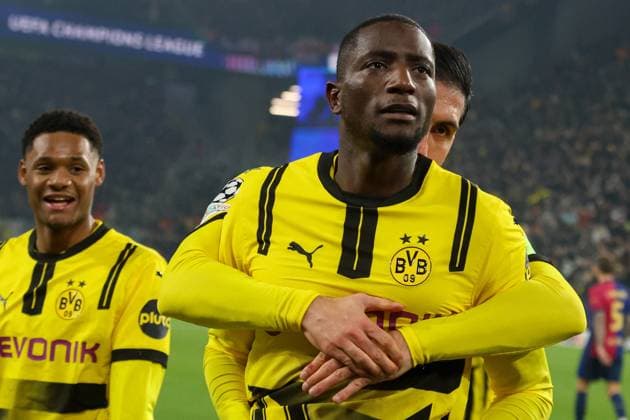 Dortmund, Germany 11 December 2024 Champions League 2024 2025 Borussia Dortmund vs FC Barcelona In the picture from left the second scorer Serhou Guirassy BVB celebrates after his goal to 1 1 with Emre Can BVB Signal Iduna Park Nordrhein Westfalen Copyright: xFotostandx xFantinix