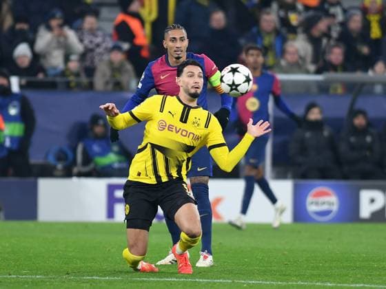 persons in a duel during the UEFA Champions League 2024 25 League Phase 6 match between Borussia Dortmund and FC Barcelona, SIGNAL IDUNA PARK on December 11, 2024 in Dortmund, Germany, Germany Photo by Ralf Treese DeFodi Images Ramy Bensebaini Borussia Dortmund and Raphinha FC Barcelona battle for the ball during the UEFA Champions League 2024 25 League Phase MD6 match between Borussia Dortmund and FC Barcelona at Signal Iduna Park on December 11, 2024 in Dortmund, Germany Defodi 521 BVBFCB20241211 031 Defodi-521