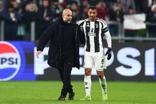 Josep Guardiola manager of Manchester City with Danilo of Juventus at full time Juventus v Manchester City, UEFA Champions League, Group Stage, Football, Allianz Stadium, Turin, Italy - 11 Dec 2024 EDITORIAL USE ONLY No use with unauthorised audio, video, data, fixture lists, club league logos or live services. Online in-match use limited to 120 images, no video emulation. No use in betting, games or single club league player publications. Copyright: xSimonxDael Shutterstockx 14984981bm