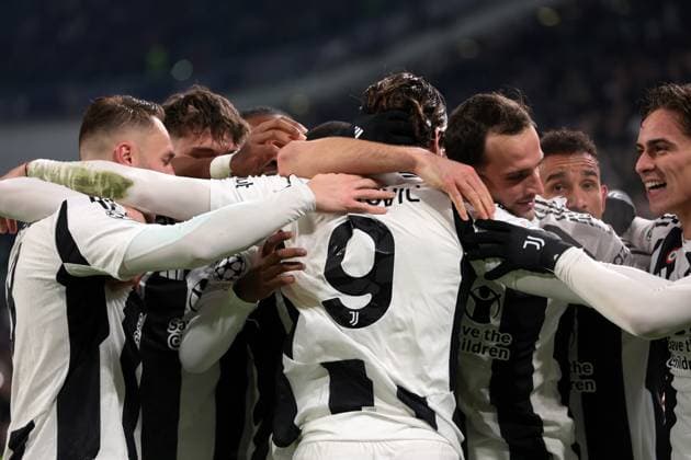 Turin, Italy, 11th December 2024. Dusan Vlahovic of Juventus celebrates with team mates after scoring to give the side a 1-0 lead during the UEFA Champions League match at Juventus Stadium, Turin. Picture credit should read: Jonathan Moscrop Sportimage EDITORIAL USE ONLY. No use with unauthorised audio, video, data, fixture lists, club league logos or live services. Online in-match use limited to 120 images, no video emulation. No use in betting, games or single club league player publications. SPI-3517-0104