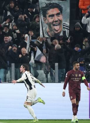 (241212) -- TURIN, Dec. 12, 2024 -- Juventus Dusan Vlahovic (L) celebrates his goal during the UEFA Champions League match between Juventus and Manchester City in Turin, Italy, Dec. 11, 2024. ) (SP)ITALY-TURIN-FOOTBALL-UEFA CHAMPIONS LEAGUE-JUVENTUS VS MANCHESTER CITY LixJing 