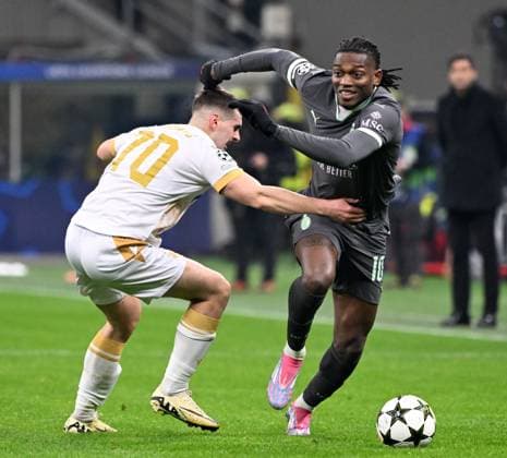 (241212) -- MILAN, Dec. 12, 2024 -- AC Milan s Rafael Leao (R) vies with Crvena Zvezda s Ognjen Mimovic during the UEFA Champions League match between AC Milan and Crvena Zvezda in Milan, Italy, Dec. 11, 2024. (Photo by Alberto Lingria Xinhua) (SP)ITALY-MILAN-FOOTBALL-UEFA CHAMPIONS LEAGUE- AC MILAN VS CRVENA ZVEZDA LixJing 