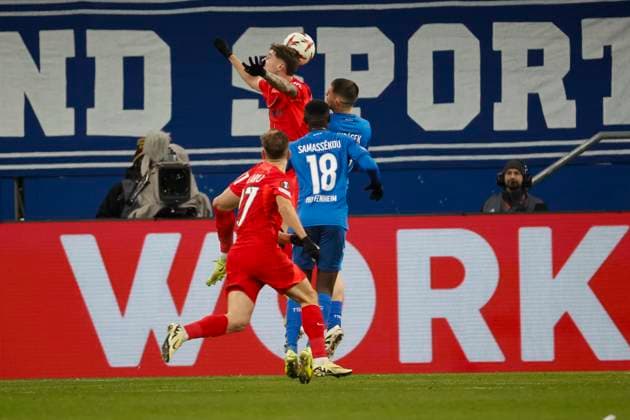 David Miculescu FCSB Bucharest, 11 and David Jurasek TSG Hoffenheim, 19 in a header duel , Soccer, UEFA Europa League, Matchday 6, 2024 2025, TSG Hoffenheim vs FCSB Bucharest, 12 12 2024, Rhein Neckar Arena, Sinsheim, Germany Sinsheim Rhein Neckar Arena Baden Württemberg Germany Copyright: xGrantxHubbsx