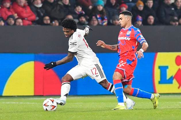 Tyrell Malacia of Manchester, left, and Cadu of Plzen in action during the football Europa League 6th round match Viktoria Plzen vs Manchester United, ManU in Pilsen, Czech Republic, December 12, 2024. (CTKxPhoto MiroslavxChaloupka) CTKPhotoP2024121207452  CTKPhotoP2024121207452
