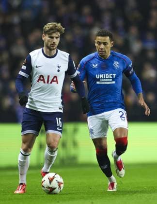 James Tavernier of Rangers in action with Timo Werner of Tottenham Hotspur during the UEFA Europa League group phase match at Ibrox Stadium, Glasgow. Rangers v Tottenham Hotspur, UEFA Europa League, Football, Ibrox Stadium, Glasgow, Scotland, UK - 12 Dec 2024 EDITORIAL USE ONLY No use with unauthorised audio, video, data, fixture lists, club league logos or live services. Online in-match use limited to 120 images, no video emulation. No use in betting, games or single club league player publications.  Copyright: xLukexNickerson RangersxFC Shutterstockx 14998163b