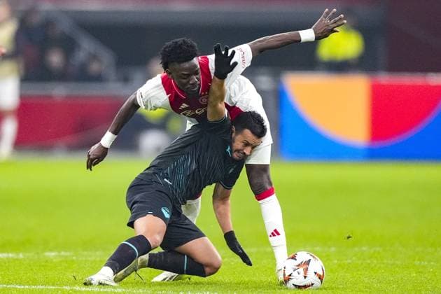 AMSTERDAM, 12-12-2024 , JohanCruyff Arena, Europa League Football, Ajax - Lazio Roma. Ajax player Bertrand Traore and Lazio Roma player Pedro Rodr™guez Ajax - Lazio Roma  x27003438x Copyright: