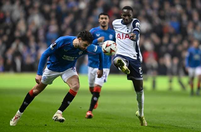 Glasgow, Scotland, 12th December 2024. Pape Matar Sarr of Tottenham Hotspur and Robin Pröpper of Rangers during the UEFA Europa League match at Ibrox Stadium, Glasgow. Picture credit should read: Neil Hanna Sportimage EDITORIAL USE ONLY. No use with unauthorised audio, video, data, fixture lists, club league logos or live services. Online in-match use limited to 120 images, no video emulation. No use in betting, games or single club league player publications. SPI-3523-0042
