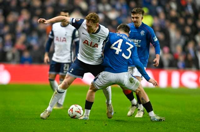 Glasgow, Scotland, 12th December 2024. Dejan Kulusevski of Tottenham Hotspur and Nicolas Raskin of Rangers during the UEFA Europa League match at Ibrox Stadium, Glasgow. Picture credit should read: Neil Hanna Sportimage EDITORIAL USE ONLY. No use with unauthorised audio, video, data, fixture lists, club league logos or live services. Online in-match use limited to 120 images, no video emulation. No use in betting, games or single club league player publications. SPI-3523-0043