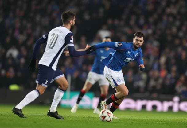Rodrigo Bentancur of Tottenham Hotspur and Robin Propper of Rangers during the Europa League group phase match at Ibrox Stadium, Glasgow. Rangers v Tottenham Hotspur, UEFA Europa League, Football, Ibrox Stadium, Glasgow, Scotland, UK - 12 Dec 2024 EDITORIAL USE ONLY No use with unauthorised audio, video, data, fixture lists, club league logos or live services. Online in-match use limited to 120 images, no video emulation. No use in betting, games or single club league player publications.  Copyright: xKirkxO Rourke RangersxFC Shutterstockx 14998166ce