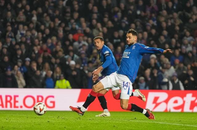 Nedim Bajrami of Rangers shoots at goal but his shot is saved by Tottenham Hotspur goalkeeper Fraser Forster. Rangers v Tottenham Hotspur, UEFA Europa League, Group Stage, Football, Ibrox Stadium, Glasgow, Scotland - 12 Dec 2024 EDITORIAL USE ONLY No use with unauthorised audio, video, data, fixture lists, club league logos or live services. Online in-match use limited to 120 images, no video emulation. No use in betting, games or single club league player publications.  Copyright: xStuartxWallace Shutterstockx 14985154bv