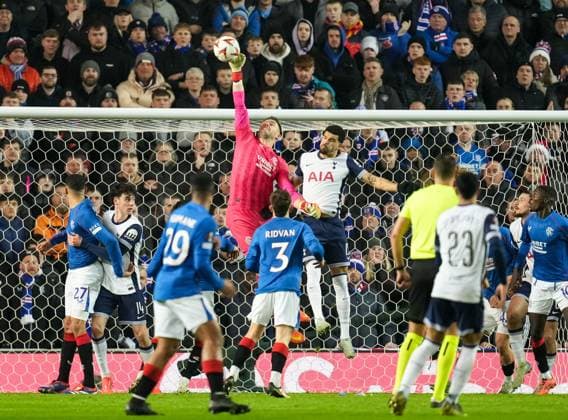 Rangers goalkeeper Jack Butland punches the ball away from goal under pressure from Dominic Solanke of Tottenham Hotspur. Rangers v Tottenham Hotspur, UEFA Europa League, Group Stage, Football, Ibrox Stadium, Glasgow, Scotland - 12 Dec 2024 EDITORIAL USE ONLY No use with unauthorised audio, video, data, fixture lists, club league logos or live services. Online in-match use limited to 120 images, no video emulation. No use in betting, games or single club league player publications.  Copyright: xStuartxWallace Shutterstockx 14985154dj
