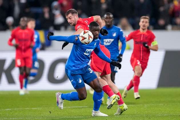 v li Stanley Pierre Nsoki N Soki, Hoffenheim, 34 , Daniel Popa FCSB Bucharest, 19 , duel, duel scene, duel, tackle, tackling, dynamics, action, action, 12 12 2024, Sinsheim Germany , Football, UEFA Europa League, Group stage, TSG 1899 Hoffenheim FCSB Bucharest, 12 12 2024, Sinsheim Germany , Football, UEFA Europa League, Group stage, TSG 1899 Hoffenheim FCSB Bucharest, DFB DFL REGULATIONS PROHIBIT ANY USE OF PHOTOGRAPHS AS IMAGE SEQUENCES AND OR QUASI VIDEO xozx