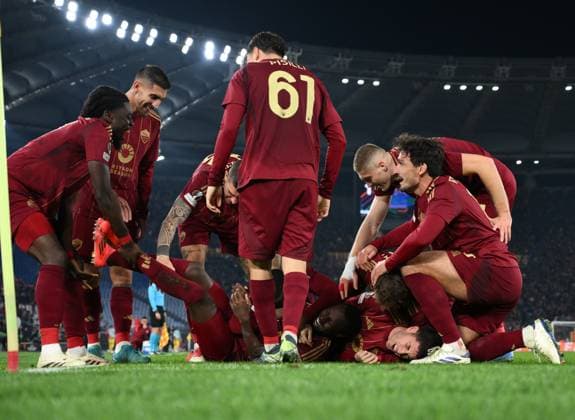 (241213) -- ROME, Dec. 13, 2024 -- Roma s Saud Abdulhamid (C, bottom) celebrates his goal with teammates during the UEFA Europa League match between Roma and Braga in Rome, Italy, Dec. 12, 2024. (Photo by Xinhua) (SP)ITALY-ROME-FOOTBALL-UEFA EUROPA LEAGUE-ROMA VS BRAGA AlbertoxLingria 