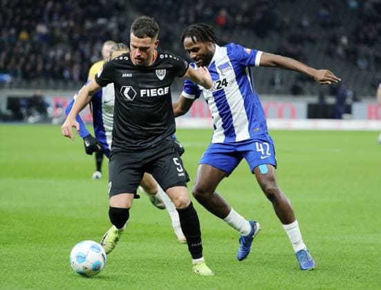 Yassine Bouchama on the ball, Deyovaisio Zeefuik duel Match scene Action Sport Football Soccer DFL 2 Bundesliga Men 16 Matchday Season 2024 2025 13 12 2024 Hertha BSC Berlin vs Preußen Münster DFL regulations prohibit any use of photographs as image sequences and or quasi video