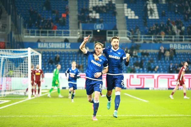 13 12 2024, xrekx, Soccer 2 Bundesliga, Karlsruher SC Jahn Regensburg emspor, v l Budu Zivzivadze Fabian Schleusener Karlsruher SC cheer the 1 1 DFL DFB REGULATIONS PROHIBIT ANY USE OF PHOTOGRAPHS as IMAGE SEQUENCES and or QUASI VIDEO Karlsruhe