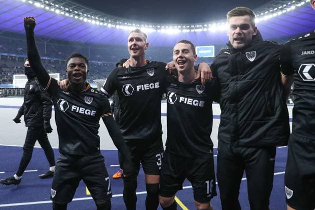13 12 2024, xtgx, Soccer 2 Bundesliga, Hertha BSC Berlin Preussen Muenster emspor, v l Daniel Kyerewaa Muenster, 7 , Holmbert Aron Fridjonsson Muenster, 31 , Torge Paetow Muenster, 16 Celebrating the victory, cheering after the match DFL DFB REGULATIONS PROHIBIT ANY USE OF PHOTOGRAPHS as IMAGE SEQUENCES and or QUASI VIDEO Berlin
