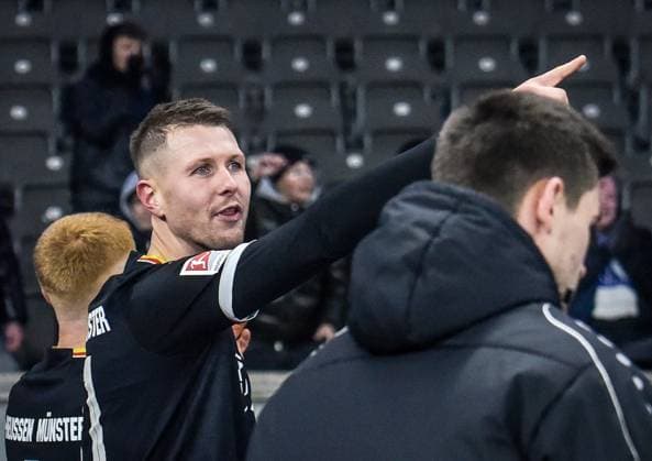 Fussball 2 Bundesliga Hertha BSC Berlin Preußen Münster 13 12 2024, xdanx, Fussball 2 Bundesliga Hertha BSC Berlin Preußen Münster v l Holmbert Fridjonsson SC Preußen Muenster 31 ,geht glücklich in die Fankurve DFL DFB REGULATIONS PROHIBIT ANY USE OF PHOTOGRAPHS as IMAGE SEQUENCES and or QUASI VIDEO Daniel Lakomski Mix1 Berlin Olympiastadion Berlin Berlin Germany EN Copyright: xDanielxLakomskix