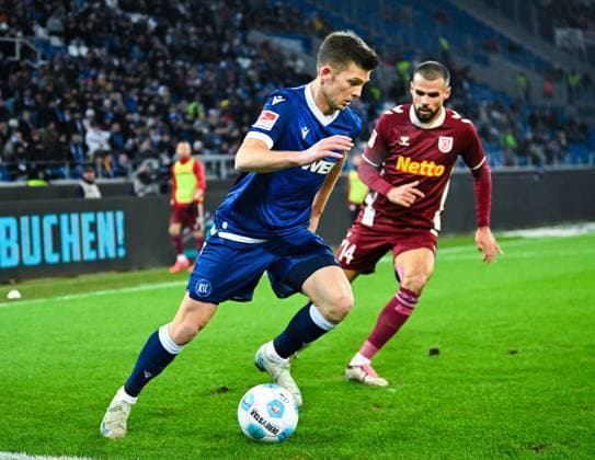 Marvin Wanitzek Karlsruher SC in action against Robin Ziegele Jahn Regensburg during the 2 Bundesliga match between Karlsruher SC and Jahn Regensburg at BBBank Wildpark on December 13, 2024 in Karlsruhe, Germany Photo by Silas Schueller DeFodi Images Marvin Wanitzek Karlsruher SC controls the ball against Robin Ziegele Jahn Regensburg during the 2 Bundesliga match between Karlsruher SC and Jahn Regensburg at BBBank Wildpark on December 13, 2024 in Karlsruhe, Germany Photo by Silas Schueller DeFodi Images DFB DFL REGULATIONS PROHIBIT ANY USE OF PHOTOGRAPHS AS IMAGE SEQUENCES AND OR QUASI VIDEO Photo by Silas Schueller DeFodi Images Defodi 738 738 KSCREG 20241213 1176 Defodi-738 DFB DFL REGULATIONS PROHIBIT ANY USE OF PHOTOGRAPHS AS IMAGE SEQUENCES AND OR QUASI-VIDEO.