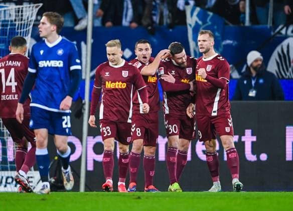 Kai Proeger Jahn Regensburg , Andreas Geipl Jahn Regensburg , Christian Kuehlwetter Jahn Regensburg and Nico Hottmann Jahn Regensburg celebrate their team s first goal during the 2 Bundesliga match between Karlsruher SC and Jahn Regensburg at BBBank Wildpark on December 13, 2024 in Karlsruhe, Germany Photo by Silas Schueller DeFodi Images Kai Proeger Jahn Regensburg , Andreas Geipl Jahn Regensburg , Christian Kuehlwetter Jahn Regensburg and Nico Hottmann Jahn Regensburg celebrate their team s first goal during the 2 Bundesliga match between Karlsruher SC and Jahn Regensburg at BBBank Wildpark on December 13, 2024 in Karlsruhe, Germany Photo by Silas Schueller DeFodi Images DFB DFL REGULATIONS PROHIBIT ANY USE OF PHOTOGRAPHS AS IMAGE SEQUENCES AND OR QUASI VIDEO Photo by Silas Schueller DeFodi Images Defodi 738 738 KSCREG 20241213 873 Defodi-738 DFB DFL REGULATIONS PROHIBIT ANY USE OF PHOTOGRAPHS AS IMAGE SEQUENCES AND OR QUASI-VIDEO.