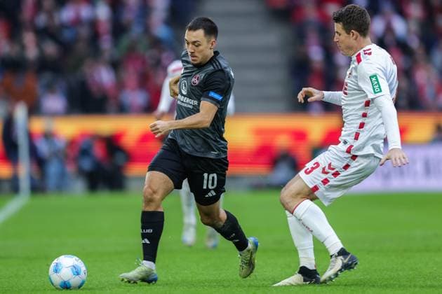 Soccer 2 Bundesliga 16 Matchday 1 FC Köln 1 FC Nürnberg on 15 12 2024 at RheinEnergieStadion in Cologne Julian Justvan Nürnberg , left Dominique Heintz Köln , right DFL regulations prohibit any use of photographs as image sequences and or quasi video xJRx