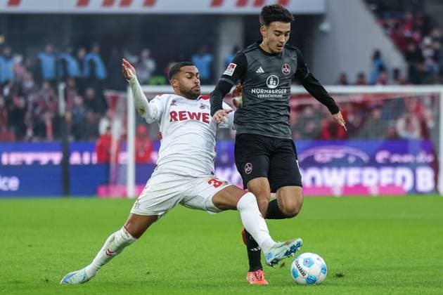 Soccer 2 Bundesliga 16 Matchday 1 FC Köln 1 FC Nürnberg on 15 12 2024 at RheinEnergieStadion in Cologne Linton Maina Köln , left Jens Castrop Nürnberg , right DFL regulations prohibit any use of photographs as image sequences and or quasi video xJRx