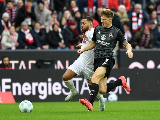 Linton Maina 1 FC Koeln and Finn Jeltsch 1 FC Nuernberg battle for the ball during the 2 Bundesliga match between 1 FC Koeln and 1 FC Nuernberg at RheinEnergieStadion on December 15, 2024 in Cologne, Germany, Germany Photo by Ralf Treese DeFodi Images Linton Maina 1 FC Koeln and Finn Jeltsch 1 FC Nuernberg battle for the ball during the 2 Bundesliga match between 1 FC Köln and 1 FC Nürnberg at RheinEnergieStadion on December 15, 2024 in Cologne, Germany Photo by Ralf Treese DeFodi Images DFB DFL REGULATIONS PROHIBIT ANY USE OF PHOTOGRAPHS AS IMAGE SEQUENCES AND OR QUASI VIDEO Defodi 521 KOEFCN20241215 010 Defodi-521 DFB DFL REGULATIONS PROHIBIT ANY USE OF PHOTOGRAPHS AS IMAGE SEQUENCES AND OR QUASI-VIDEO.