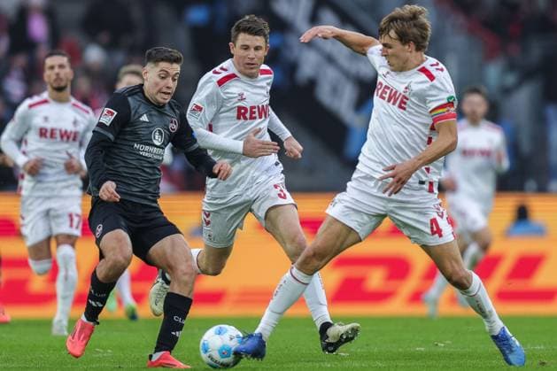 Soccer 2 Bundesliga 16 Matchday 1 FC Köln 1 FC Nürnberg on 15 12 2024 at RheinEnergieStadion in Cologne Stefanos Tzimas Nürnberg , left Dominique Heintz Köln , center Timo Hübers Köln , right DFL regulations prohibit any use of photographs as image sequences and or quasi video xJRx