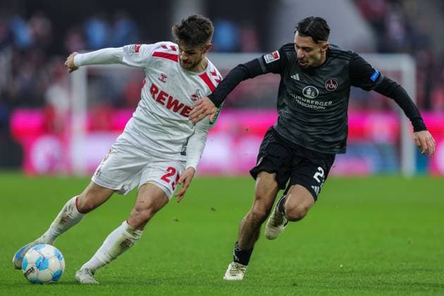 Soccer 2 Bundesliga 16 Matchday 1 FC Köln 1 FC Nürnberg on 15 12 2024 at RheinEnergieStadion in Cologne Jan Thielmann Köln , left Berkay Yilmaz Nürnberg , right DFL regulations prohibit any use of photographs as image sequences and or quasi video xJRx