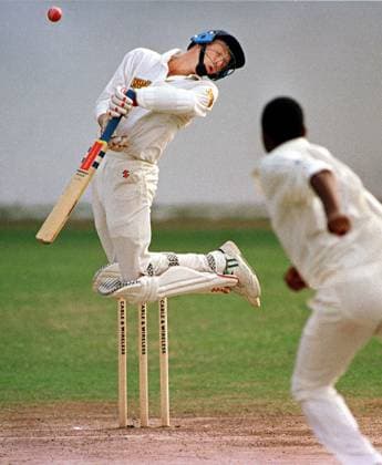 WEST INDIES V ENGLAND 1st TEST AT SIBANA PARK JAMAICA JAN 1994. MIKE ATHERTON JUMPS AWAY FROM A BALL OFF COURTNEY WALSH PICTURE DAVID ASHDOWN. 9ash copy.jpg DMGTCHPDPICT000402664480