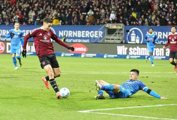 21 12 2024 Soccer Season 2024 2025 2 Soccer Bundesliga 17 Matchday 1 FC Nürnberg FCN Club Eintracht Braunschweig EBS BTSV Sportfoto Zink DaMa xdaxmax DFL regulations prohibit any use of photographs as image sequences and or quasi video only for editorial use Stefanos Tzimas 9, 1 FC Nürnberg FCN with shot on goal