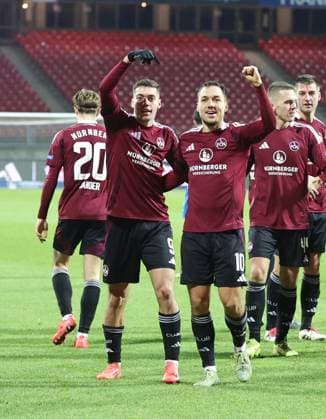 21 12 2024 Soccer Season 2024 2025 2 Soccer Bundesliga 17 Matchday 1 FC Nürnberg FCN Club Eintracht Braunschweig EBS BTSV Sportfoto Zink DaMa xdaxmax DFL regulations prohibit any use of photographs as image sequences and or quasi video only for editorial use Jubel Freude Torjubel nach Tor zum 1 0 Stefanos Tzimas 9, 1 FC Nürnberg FCN Julian Justvan 10, 1 FC Nürnberg FCN und Mannschaft Team jubelt freut sich Torschütze Stefanos Tzimas 9, 1 FC Nürnberg FCN