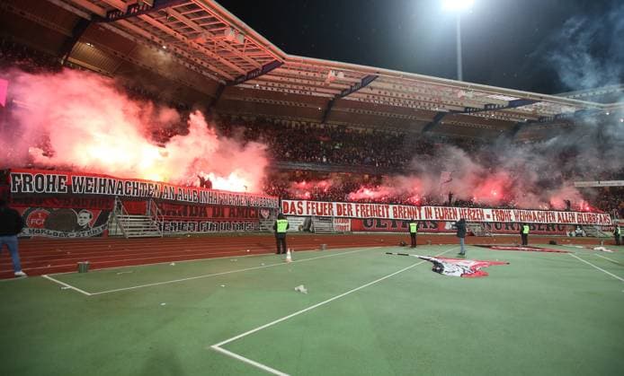 21 12 2024 Soccer Season 2024 2025 2 Soccer Bundesliga 17 Matchday 1 FC Nürnberg FCN Club Eintracht Braunschweig EBS BTSV Sportfoto Zink DaMa xdaxmax DFL regulations prohibit any use of photographs as image sequences and or quasi video only for editorial use Clubfan Clubfans FCN Fans Fans Fans wish Merry Christmas Pyrotechnics Pyro Bengal torches Bengal torches Smoke