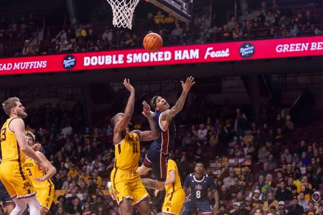 December 21, 2024, Minneapolis, Minnesota, United States: Farleigh Dickerson University player TERRENCE BROWN sends the ball towards the net. The University of Minnesota and Farleigh Dickinson University faced off at Williams Arena in Minneapolis Minnesota on Saturday December 21st. The University of Minnesota was victorious, winning by a score of 74-60. Minneapolis United States - ZUMAt166 20241221_zsp_t166_009 Copyright: xMichaelxTurnerx