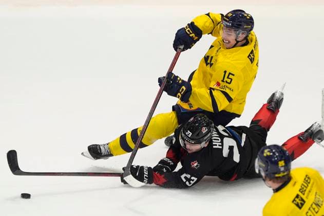 December 21, 2024, Ottawa, On, Canada: Canada forward Tanner Howe knocks the puck away from Sweden forward David Edstrom during third period IIHF World Junior Hockey Championship pre-tournament action, Saturday, Dec. 21, 2024 in Ottawa. David Edstrom Tanner Howe  - ZUMAc35_ 20241221_zaf_c35_034 Copyright: xAdrianxWyldx