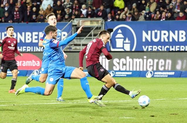 21 12 2024 Soccer Season 2024 2025 2 Soccer Bundesliga 17 Matchday 1 FC Nürnberg FCN Club Eintracht Braunschweig EBS BTSV Sportfoto Zink DaMa xdaxmax DFL regulations prohibit any use of photographs as image sequences and or quasi video only for editorial use Julian Justvan 10, 1 FC Nürnberg FCN with shot on goal