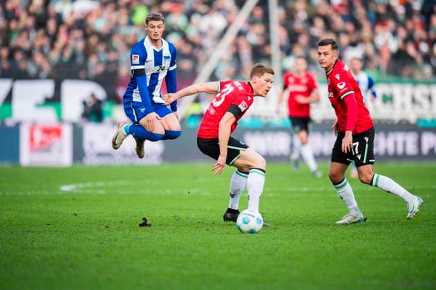 22 12 2024 Football, 2024 2025, 2 Bundesliga, Matchday 17, Hannover 96 Hertha BSC Berlin L R Michael Cuisance Berlin , Marcel Halstenberg Hannover , Bartlomiej Wdowik Hannover DFL REGULATIONS PROHIBIT ANY USE OF PHOTOGRAPHS AS IMAGE SEQUENCES AND OR QUASI VIDEO Hannover Lower Saxony Germany Heinz von Heiden Arena