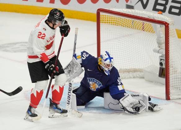 December 26, 2024, Ottawa, On, Canada: Canada forward Porter Martone (22) pressures Finland goaltender Petteri Rimpinen as he makes a glove save during first period IIHF World Junior Hockey Championship tournament action, Thursday, Dec.26, 2024 in Ottawa. Porter Martone Petteri Rimpinen  - ZUMAc35_ 20241226_zaf_c35_088 Copyright: xAdrianxWyldx