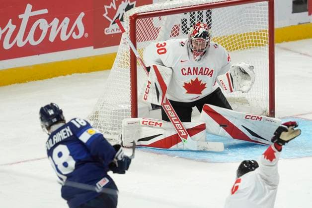 December 26, 2024, Ottawa, On, Canada: Finland forward Rasmus Kumpulainen (18) fires the puck towards Canada goalkeeper Carter George (30) during third period IIHF World Junior Hockey Championship tournament action, Thursday, Dec.26, 2024 in Ottawa. Rasmus Kumpulainen Carter George  - ZUMAc35_ 20241226_zaf_c35_099 Copyright: xAdrianxWyldx