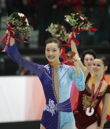 Japanese figure skater Shizuka Arakawa skates with her gold medal following the ladies free skating program during the 2006 Winter Olympics on Thursday, February 23, 2006 at Palavela in Turin, Italy. Arakawa is followed by silver medalist Sasha Cohen, of the USA. (Barbara L. Johnston Philadelphia Inquirer KRT) Turin ITA EDITORIAL USE ONLY Copyright: xx BarbaraxL.xJohnstonx krtphotos312860