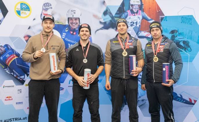 photographer FIL Michael Kristen 28 12 2024 Austrian Championships, Olympia Ice Track Innsbruck Igls, Tirol, Austria AUT , Award Ceremony, Men™s Doubles, picture Juri Thomas Gatt, Riccardo Martin Schöpf AUT, 2nd place , Yannick Müller, Armin Frauscher AUT, 1st place