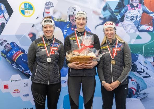 photographer FIL Michael Kristen 28 12 2024 Tyrolean Championships, Olympia Ice Track Innsbruck Igls, Tirol, Austria AUT , Award Ceremony, Women™s Singles, picture Lisa Schulte AUT, 2nd place , Madeleine Egle AUT, 1st place , Barbara Allmaier AUT, 3rd place
