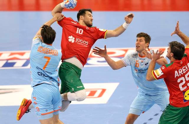 Photo Goal throw of Miguel Martins Portugal , he throws against Niko Blaauw NED and Robin Schoenaker left , NED European Handball Championship, Main Round in Hamburg , on Tue 23 01 2024 Netherlands Portugal 33 33