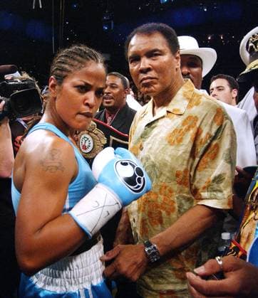 KRT SPORTS STORY SLUGGED: BOX-ALI KRT PHOTOGRAPH BY OLIVIER DOULIERY ABACA PRESS (June 12) With her father Muhammad Ali by her side, World Boxing Champion Laila Ali celebrates her victory over Erin Toughill, Saturday night, June 11, 2005, at the MCI Center in Washington, D.C. Ali won the fight via TKO for the WBC WIBA Super Middleweight Championship. (smd) 2005 WASHINGTON DC USA EDITORIAL USE ONLY Copyright: xworldxrightsx 1018469 OLIVIERxDOULIERYx krtphotoslive175974