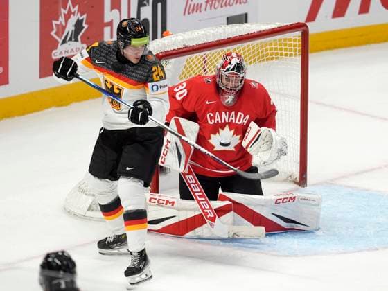 December 29, 2024, Ottawa, On, Canada: Germany forward Clemens Sager (24) tries to tip the puck past Canada goaltender Carter George during first period IIHF World Junior Hockey Championship tournament action in Ottawa, Sunday, Dec. 29, 2024. Carter George Clemens Sager  - ZUMAc35_ 20241229_zaf_c35_079 Copyright: xAdrianxWyldx
