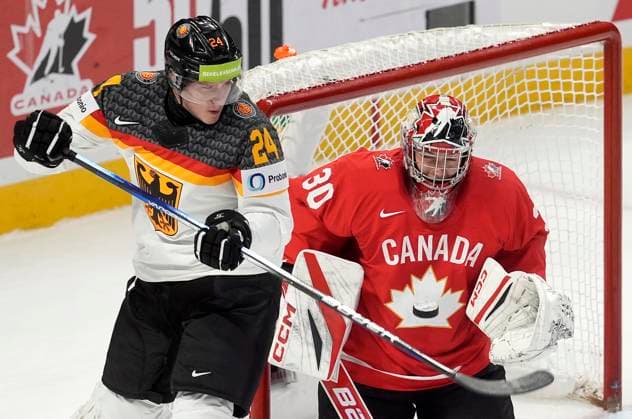 December 29, 2024, Ottawa, On, Canada: Germany forward Clemens Sager (24) tries to tip the puck past Canada goaltender Carter George during first period IIHF World Junior Hockey Championship tournament action in Ottawa, Sunday, Dec. 29, 2024. Carter George Clemens Sager  - ZUMAc35_ 20241229_zaf_c35_080 Copyright: xAdrianxWyldx