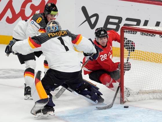 December 29, 2024, Ottawa, On, Canada: Canada forward Mathieu Cataford (28) tries to tuck the puck in the net behind Germany goaltender Nico Pertuch as he is pressured by Germany forward Noah Samanski (8) during first period IIHF World Junior Hockey Championship tournament action in Ottawa, Sunday, Dec. 29, 2024. Mathieu Cataford Nico Pertuch Noah Samanski  - ZUMAc35_ 20241229_zaf_c35_081 Copyright: xAdrianxWyldx