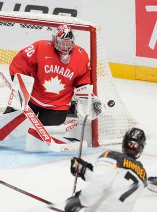 December 29, 2024, Ottawa, On, Canada: Canada goaltender Carter George cuts off the angle as Germany defenceman Carlos Handel takes a shot during second period IIHF World Junior Hockey Championship tournament action in Ottawa, Sunday, Dec. 29, 2024. Carter George Carlos Handel  - ZUMAc35_ 20241229_zaf_c35_090 Copyright: xAdrianxWyldx