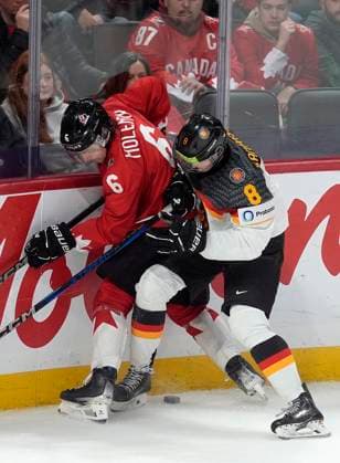 December 29, 2024, Ottawa, On, Canada: Canada defenceman Tanner Molendyk (6) and Germany forward Noah Samanski (8) battle for control of the puck along the boards during third period IIHF World Junior Hockey Championship tournament action in Ottawa, Sunday, Dec. 29, 2024. Tanner Molendyk Noah Samanski  - ZUMAc35_ 20241229_zaf_c35_095 Copyright: xAdrianxWyldx