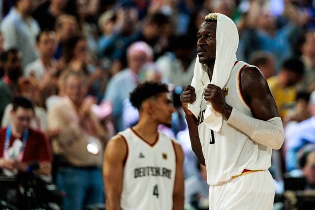 FRA, Paris, Olympic Games Paris 2024, 10 08 2024, Basketball Men 3rd place match Germany Serbia Bercy Arena Isaac Bonga Germany, 0 with towel over his head, frustrated, sad, dejected after the defeat Copyright: HMBxMedia SteffiexWunderl